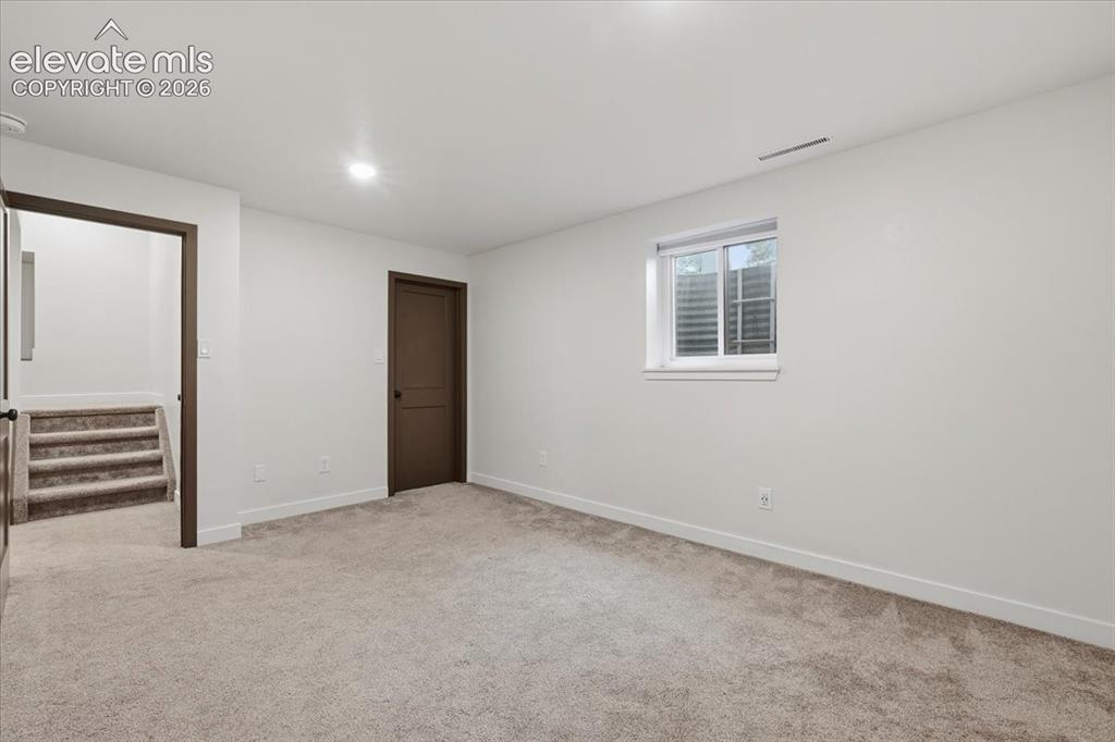 Image 42 of 50: Bedroom 5 - Basement Recessed lighting, walk in closet and crawlspace acces