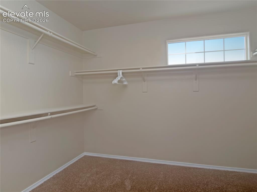 Image 13 of 18: main bedroom walk in closet-huge