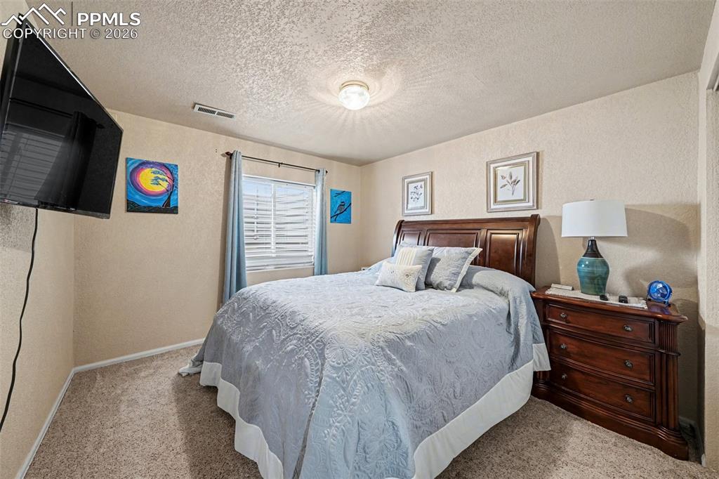 Image 13 of 23: Bedroom