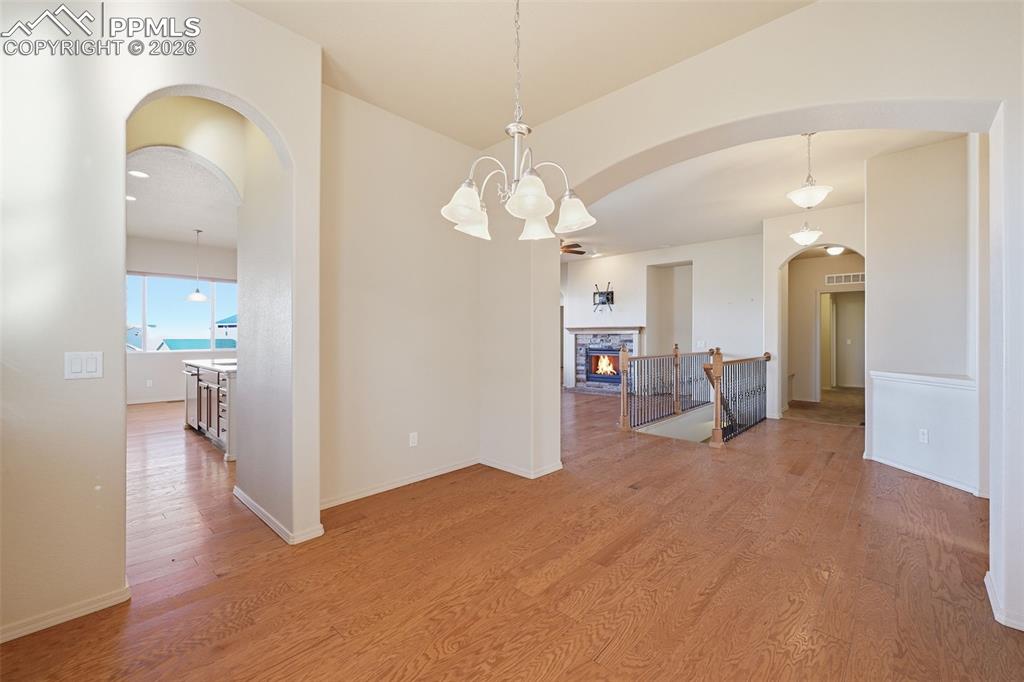Image 9 of 42: Dining area with entry to kitchen