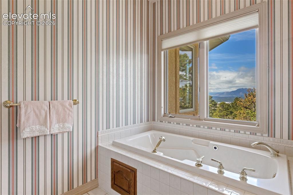 Image 26 of 48: Main level suite bathroom