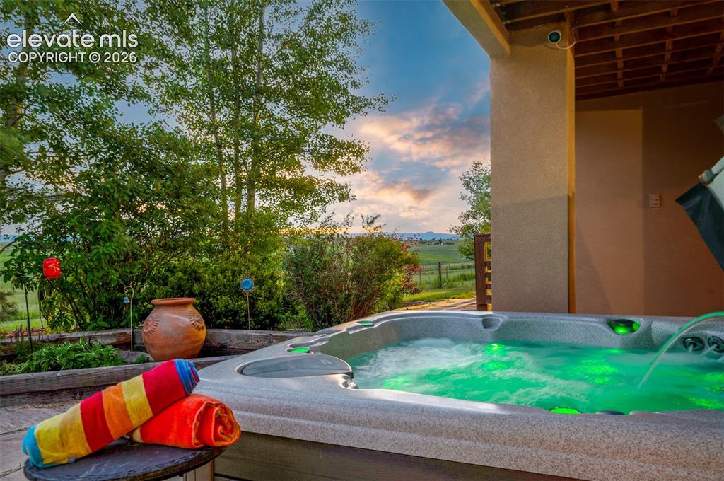 Image 37 of 49: Hot tub included with views!