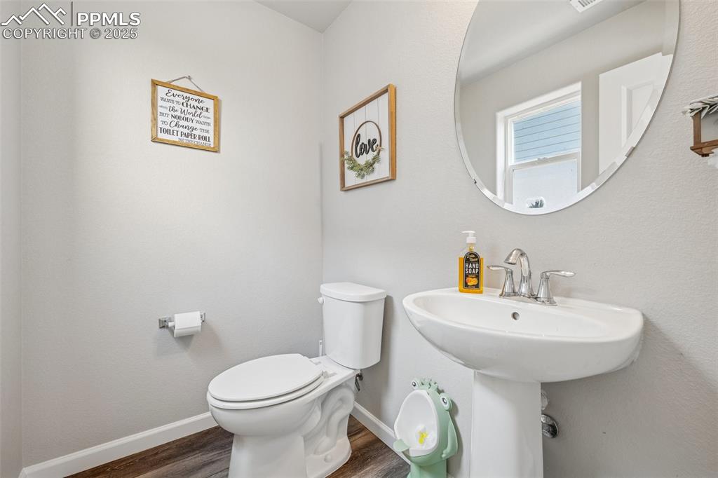 Image 21 of 30: Lower Level half bath
