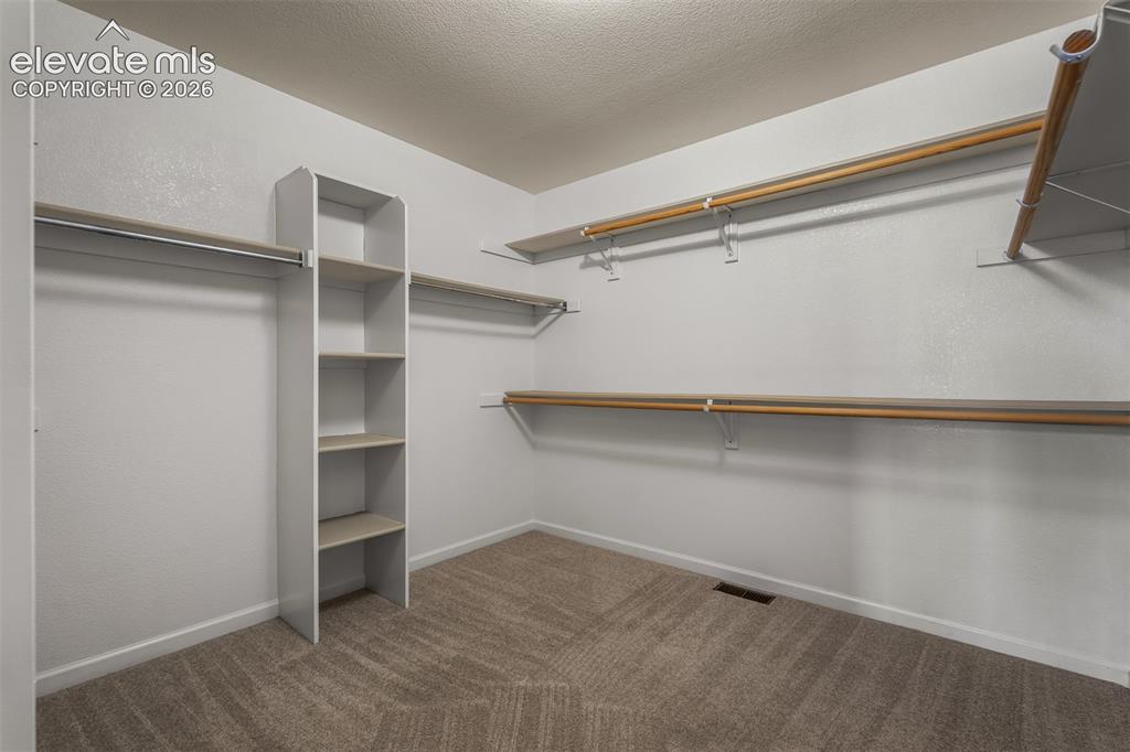 Image 28 of 46: Walk In Spacious Closet In Primary Bedroom