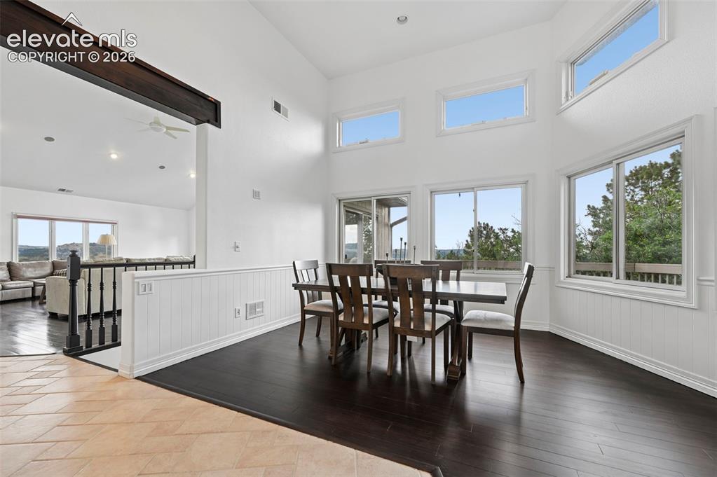 Image 16 of 45: Vaulted ceilings and abundant natural light highlight this dining area with