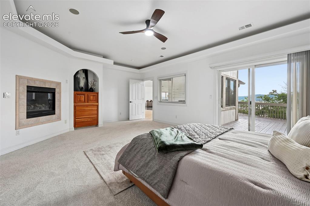 Image 20 of 45: Spacious room featuring a contemporary ceiling fan, recessed lighting, and 