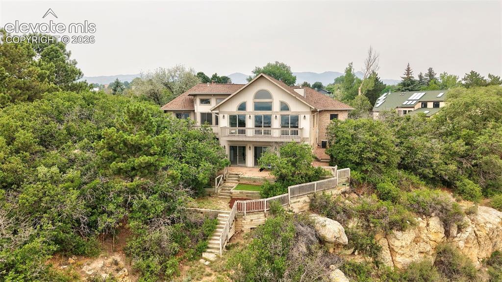Image 3 of 45: Architectural residence featuring a two-story design with extensive glazing
