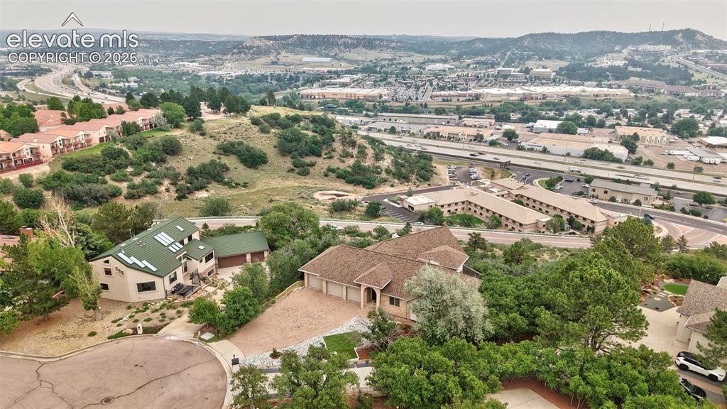 Image 4 of 45: Aerial perspective showcasing a residential property with a multi-car garag