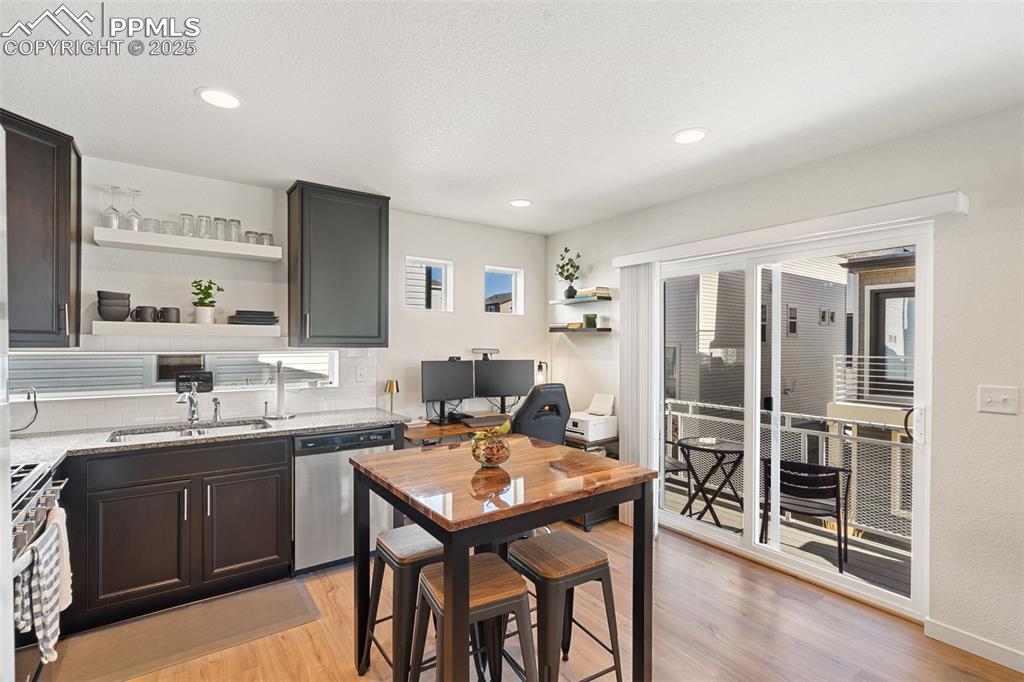 Image 11 of 15: Kitchen/Dining Area + slider door to balcony-deck