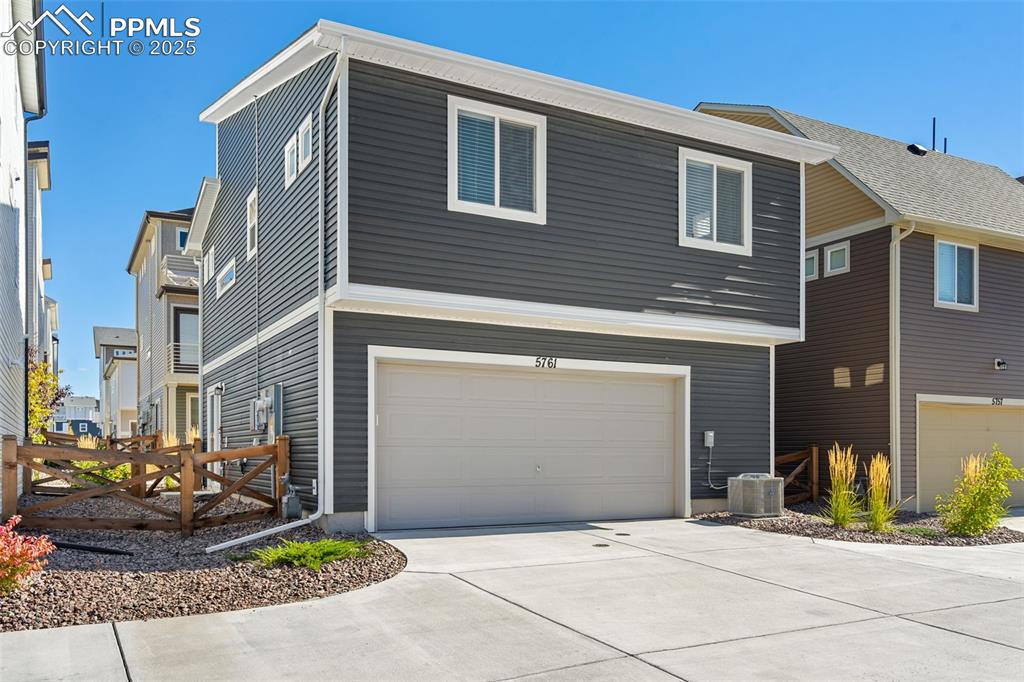 Image 14 of 15: 2 car garage, 2 remotes and keypad