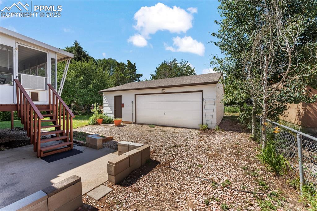 Image 3 of 39: Detached 2 car garage with workshop
