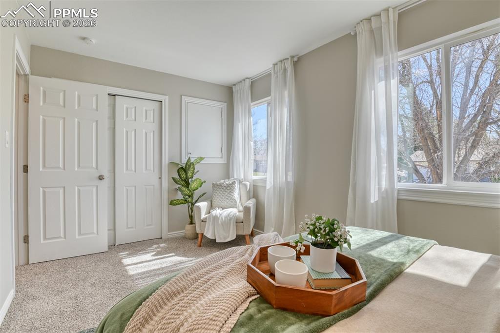 Image 16 of 39: Bright room featuring light grey walls, white trim, and a window with a vie