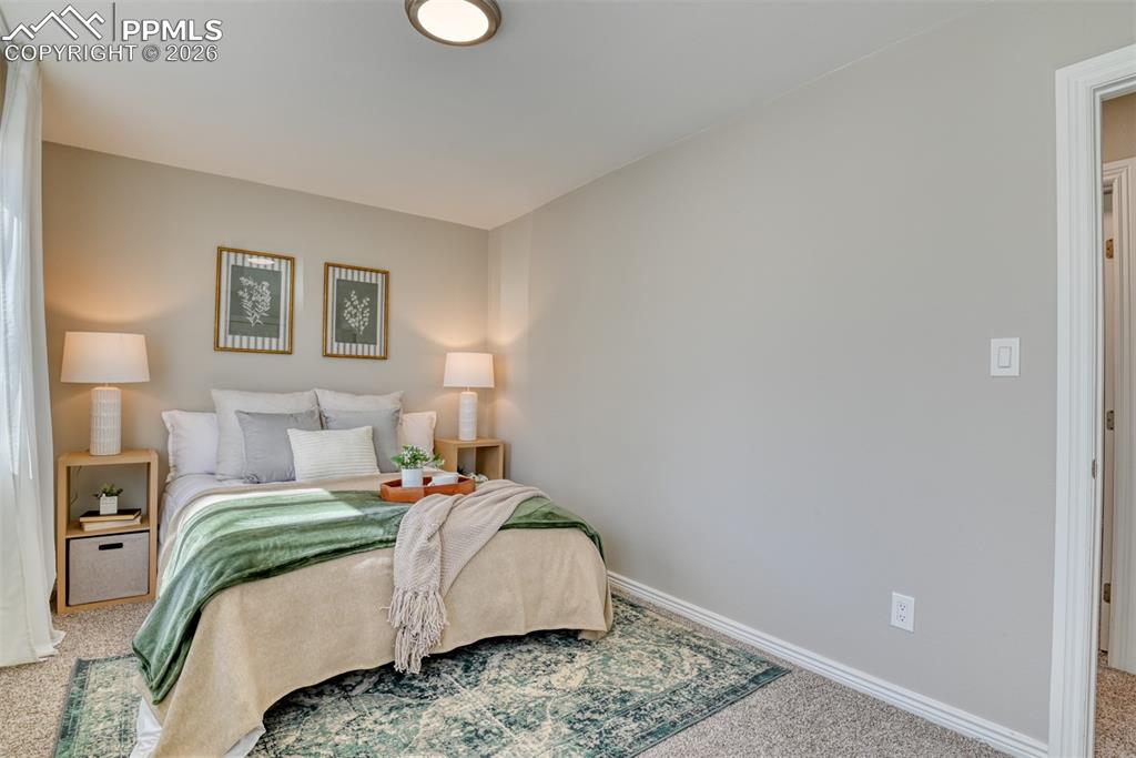 Image 18 of 39: Bedroom featuring light gray walls, carpeted flooring, and a ceiling light