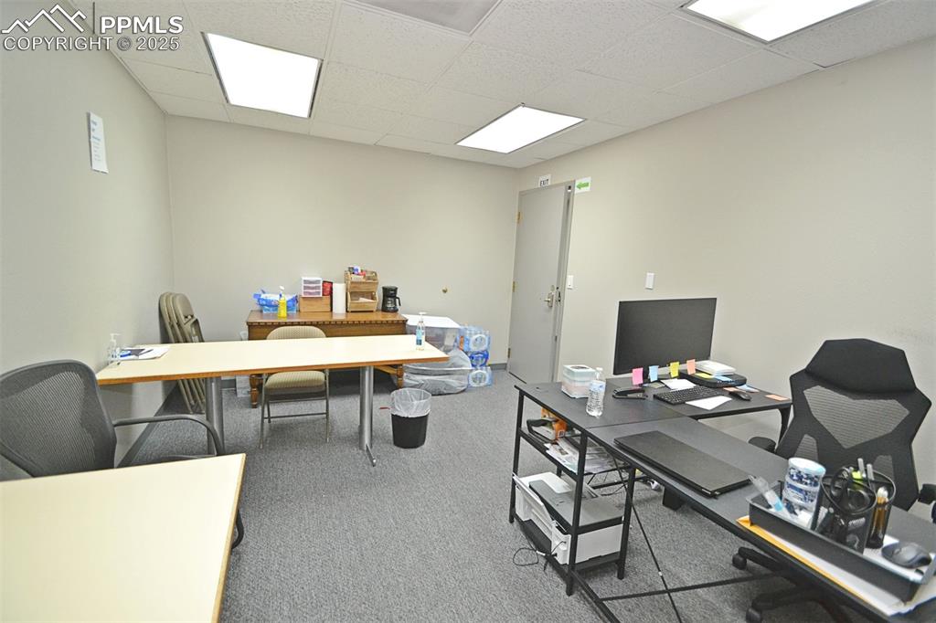 Image 11 of 16: Home office featuring carpet floors and a paneled ceiling