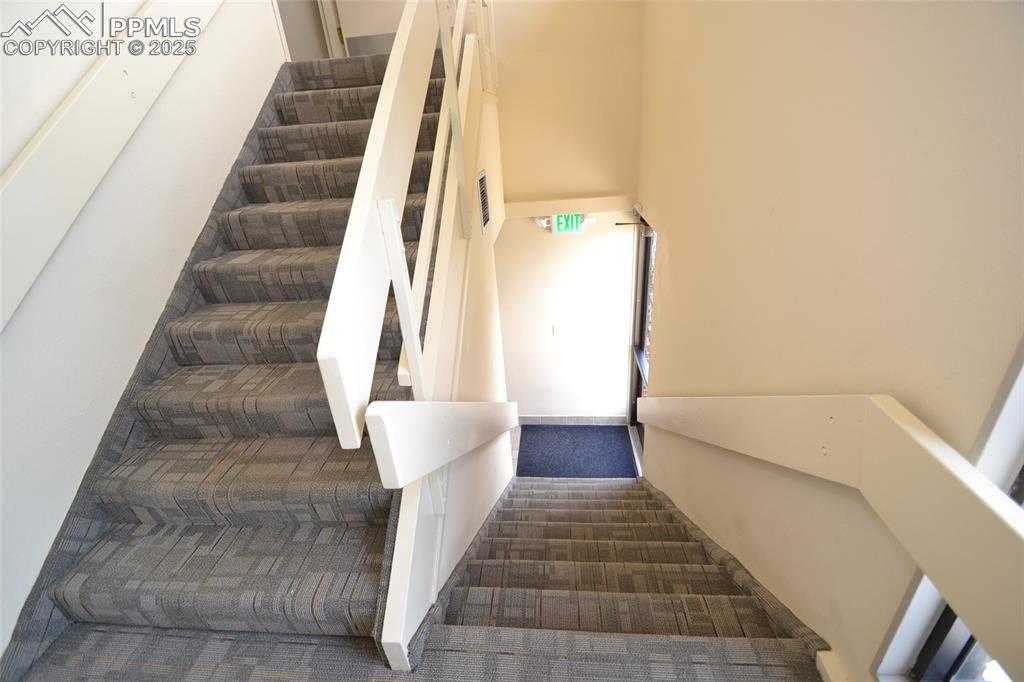 Image 12 of 16: Staircase featuring carpet