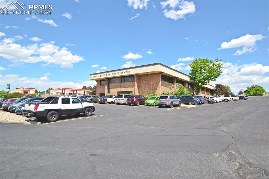 Image 14 of 16: View of commercial location featuring uncovered parking