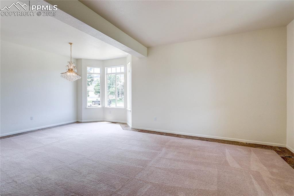 Image 6 of 50: combination formal living and dining room