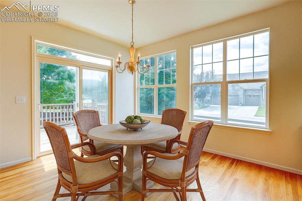 Image 8 of 50: Kitchen nook dining area virtually staged