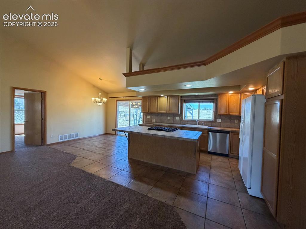 Image 11 of 21: Kitchen and Dining Area