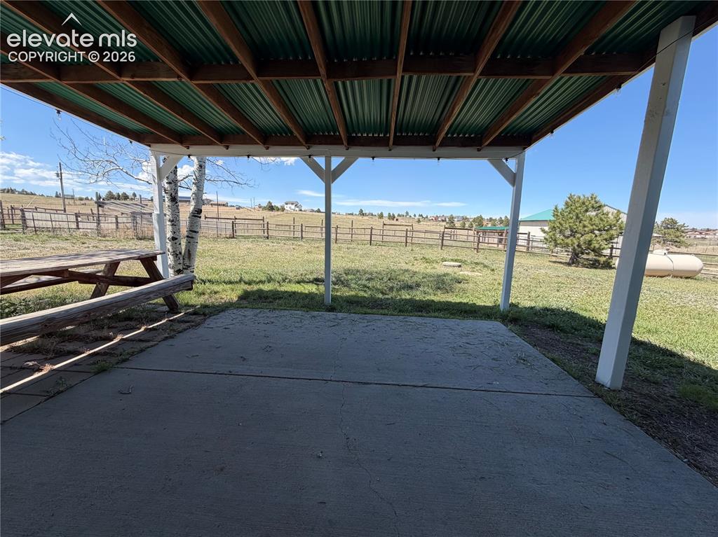 Image 6 of 21: Covered Patio in Backyard