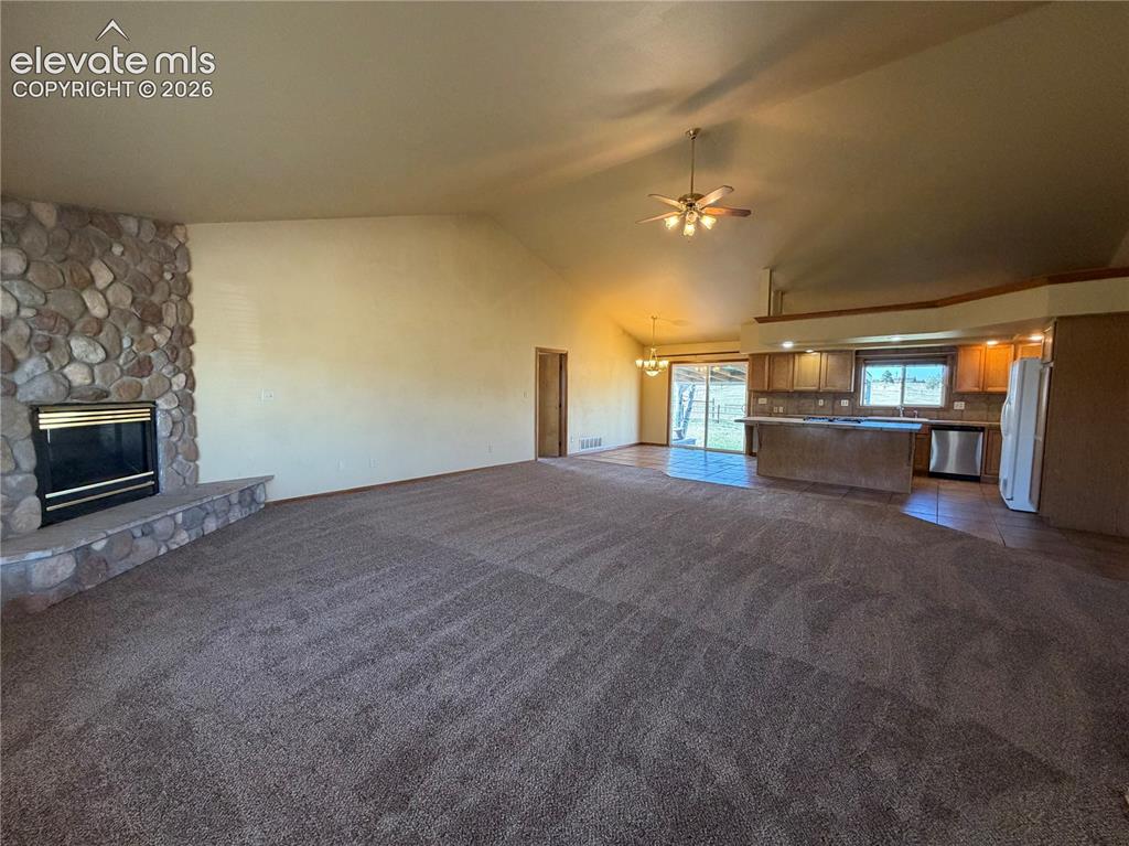 Image 8 of 21: Great Room with Vaulted Ceilings
