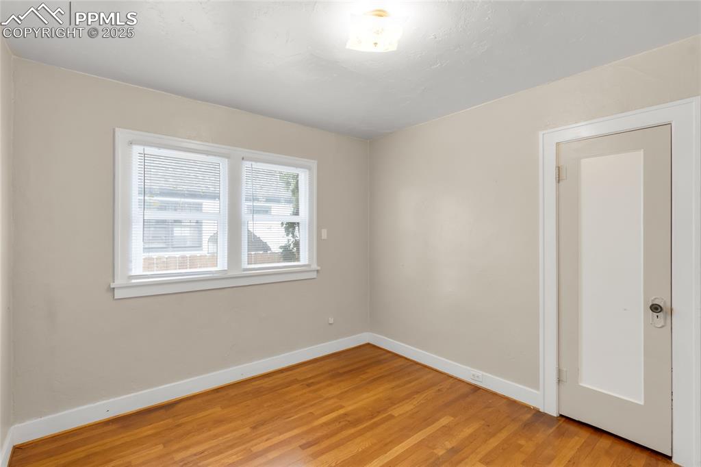 Image 19 of 39: Unfurnished room featuring light wood-type flooring and baseboards