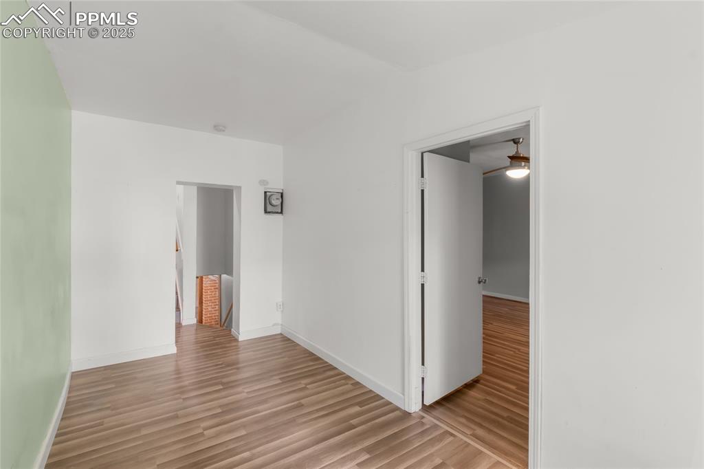 Image 26 of 39: Spare room featuring light wood-style floors