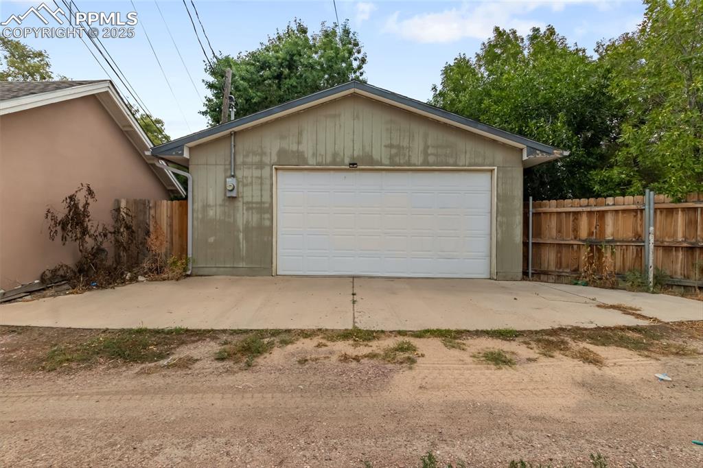 Image 33 of 39: View of detached garage from the alley