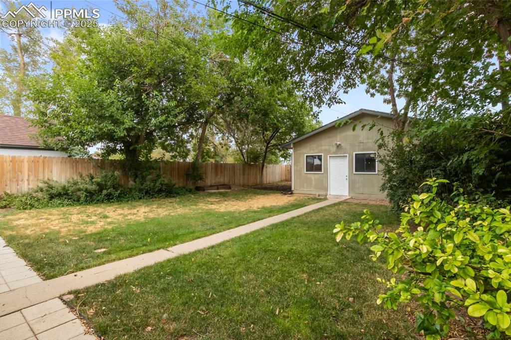 Image 36 of 39: View of fenced backyard