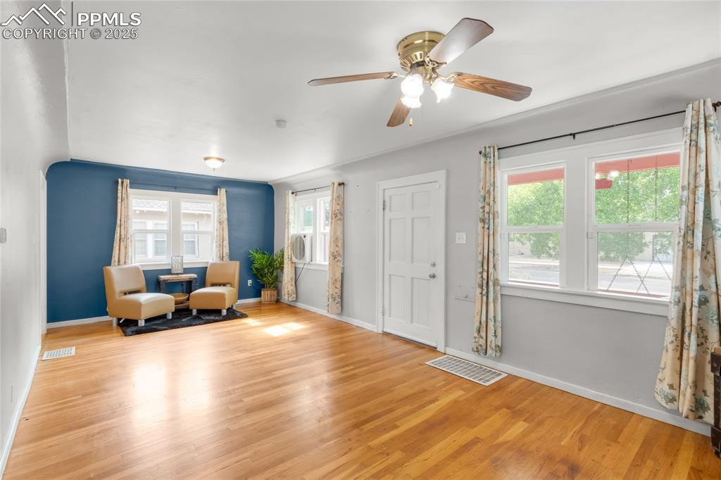 Image 6 of 39: Entrance foyer featuring plenty of natural light, wood finished floors, and