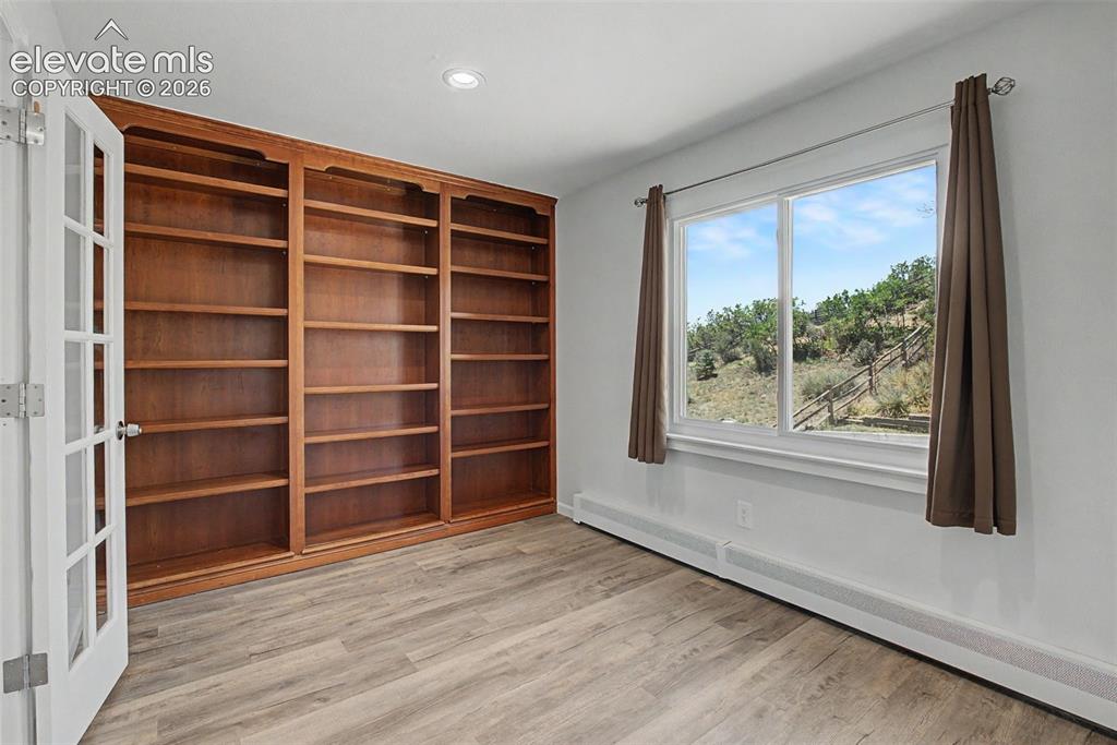 Image 19 of 49: Home Office with Built-In Shelving