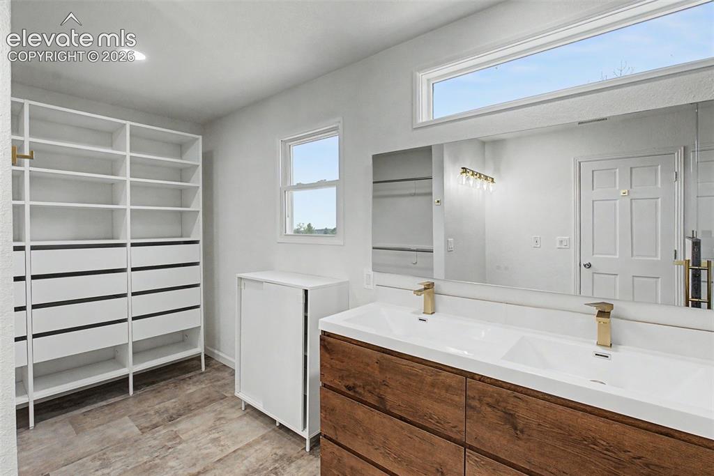 Image 26 of 49: Primary Bath with Built-In Storage