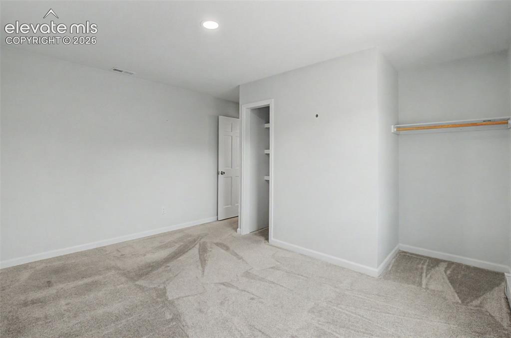 Image 28 of 49: Secondary Bedroom with Ample Closet Space