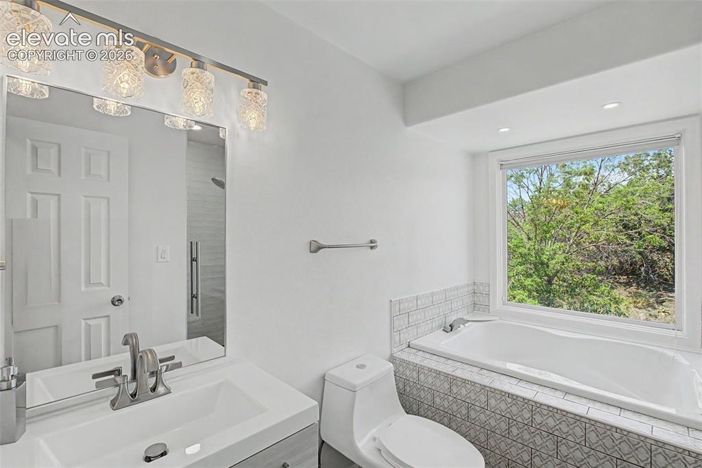 Image 31 of 49: Full Secondary Bathroom with Soaking Tub