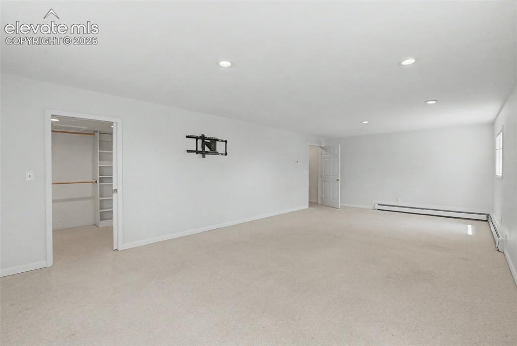 Image 33 of 49: Large Lower-Level Bedroom