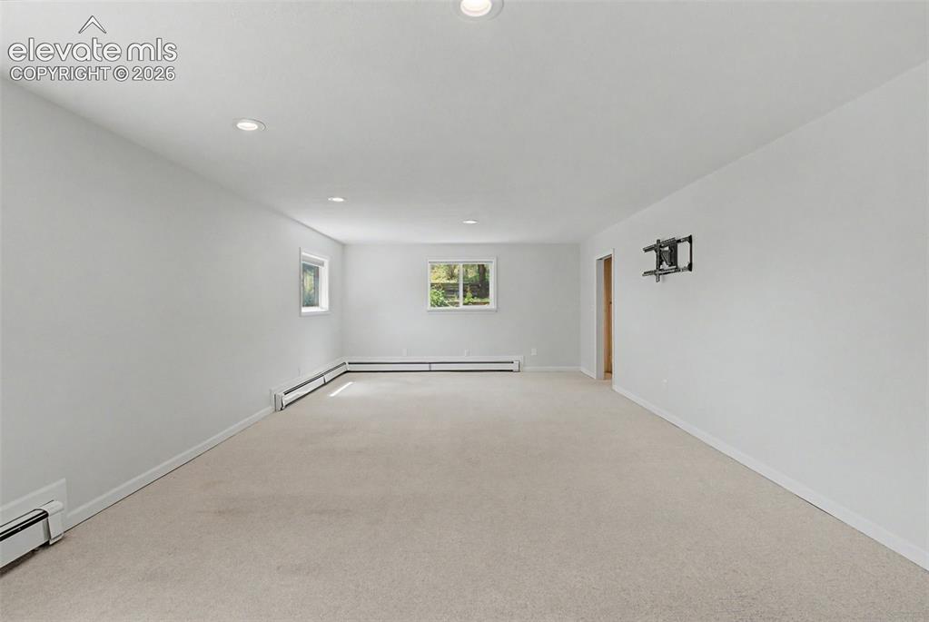 Image 34 of 49: Lower-Level Bedroom / Flexible Space