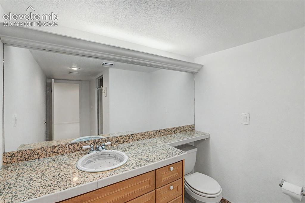 Image 36 of 49: Lower-Level Bathroom