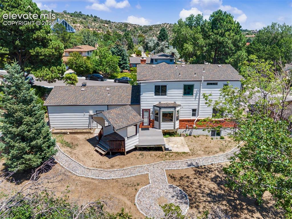 Image 43 of 49: Aerial View of Backyard & Home