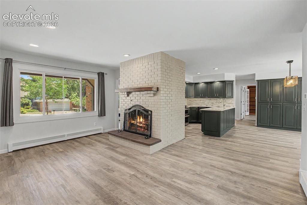 Image 7 of 49: Bright Living Room with Large Picture Window