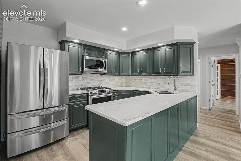Image 9 of 49: Updated Kitchen with Stainless Steel Appliances