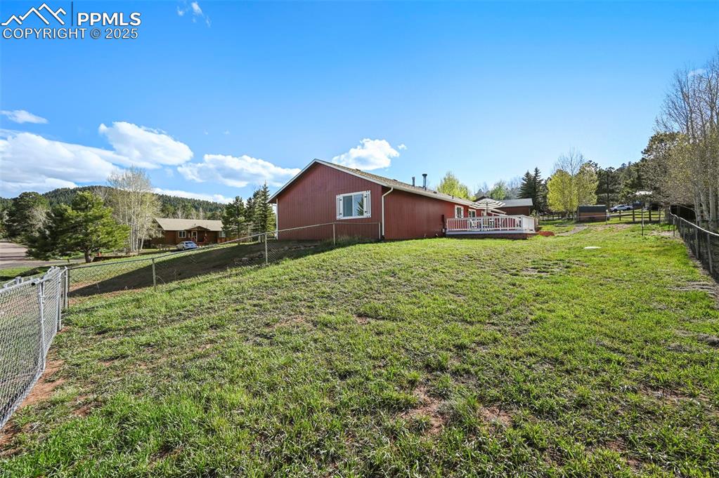 Image 26 of 32: Double gate that opens up to allow for RV and trailer parking