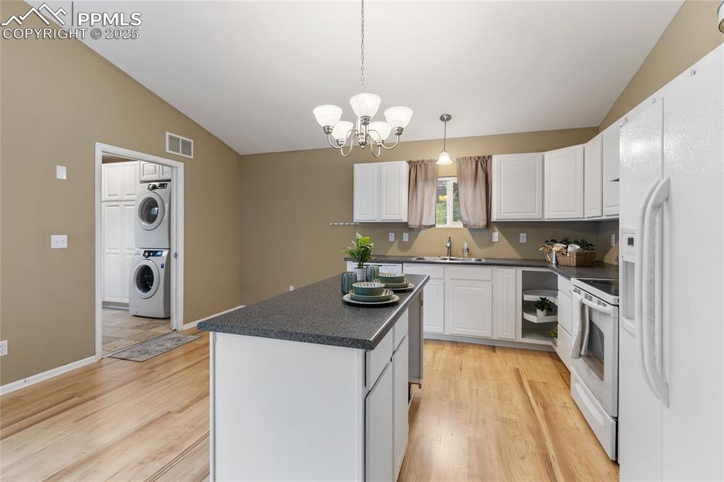 Image 13 of 27: Can you see the laundry room playing peek a boo inside the mudroom?