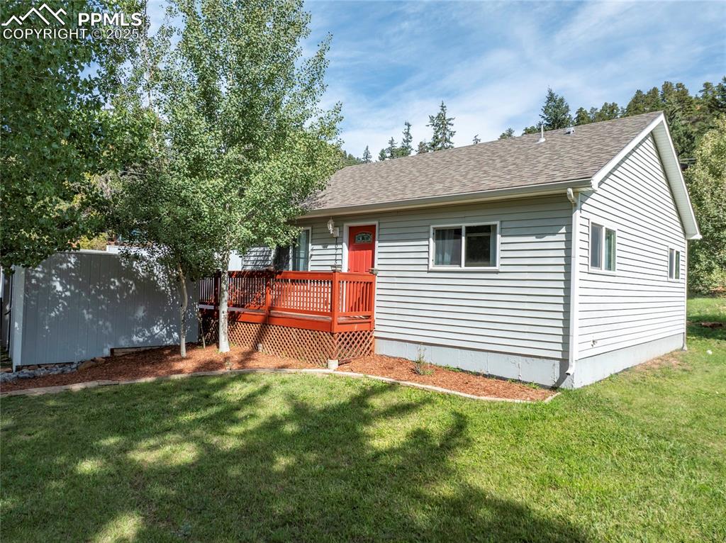 Image 2 of 27: A little bungalow on a beautiful treed, corner lot
