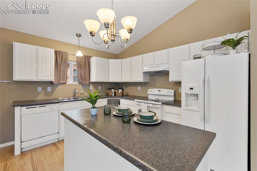 Image 8 of 27: Well, come on it and take a look around at the spacious kitchen.
