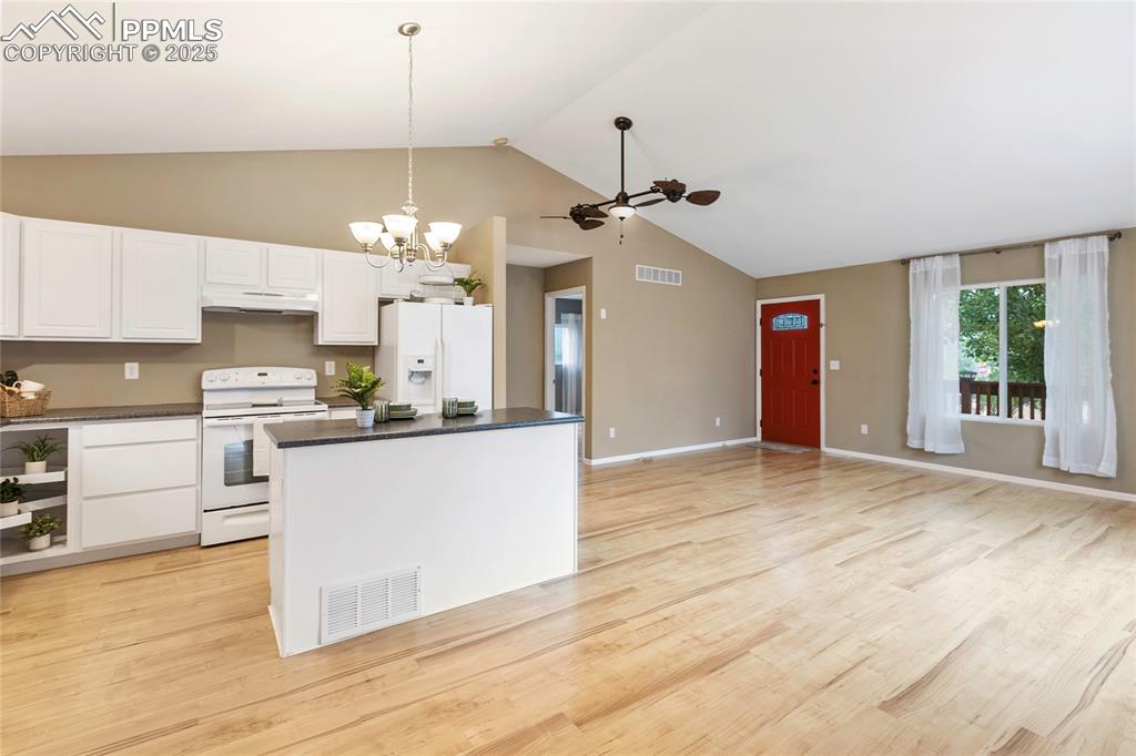 Image 9 of 27: Lots of room in the kitchen, dining and living room combo