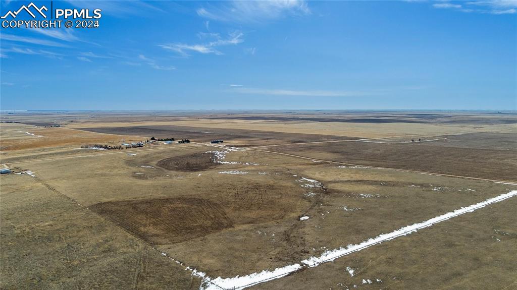 Image 6 of 14: Birds eye view of property with a rural view