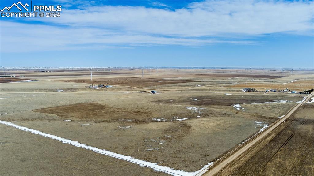 Image 8 of 14: Birds eye view of property with a rural view