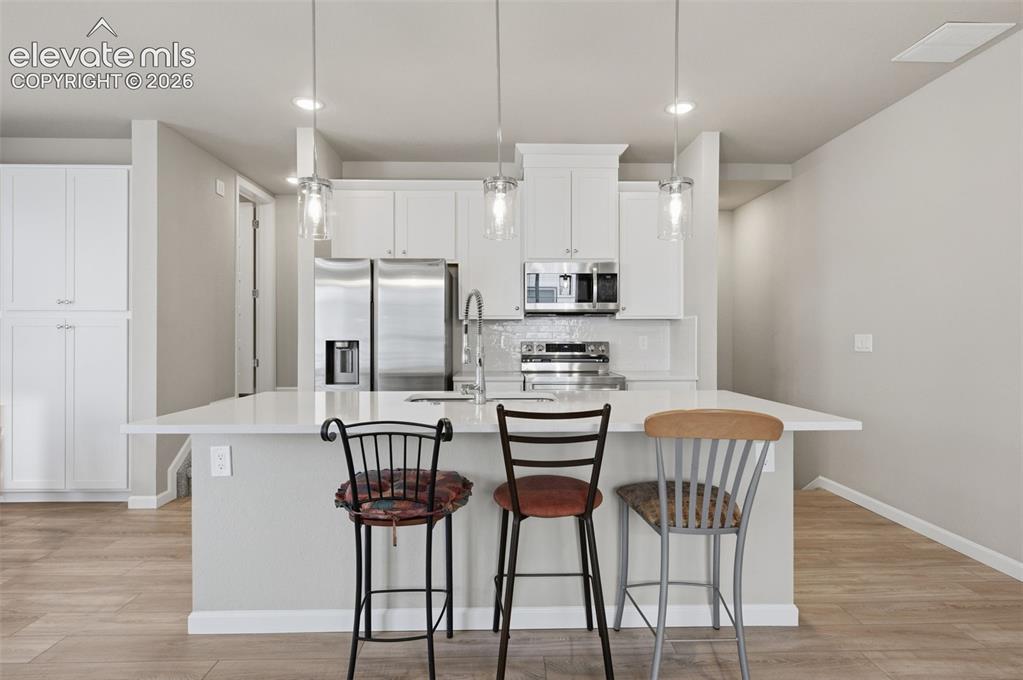 Image 12 of 24: Breakfast bar at kitchen island