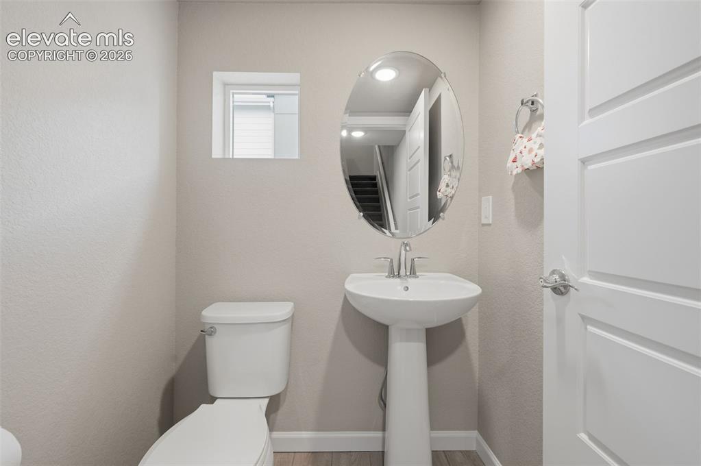 Image 17 of 24: Half bathroom is near the kitchen