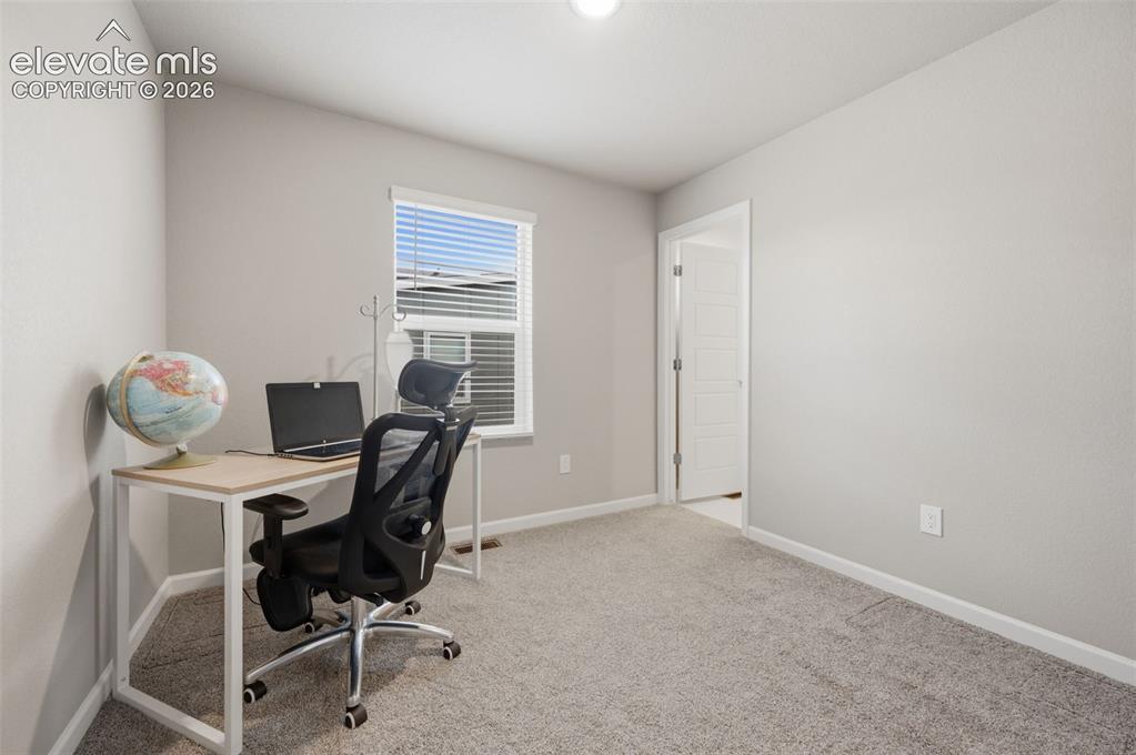 Image 19 of 24: Second bedroom with an adjacent full bath